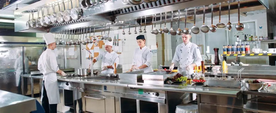chefs cooking in kitchen