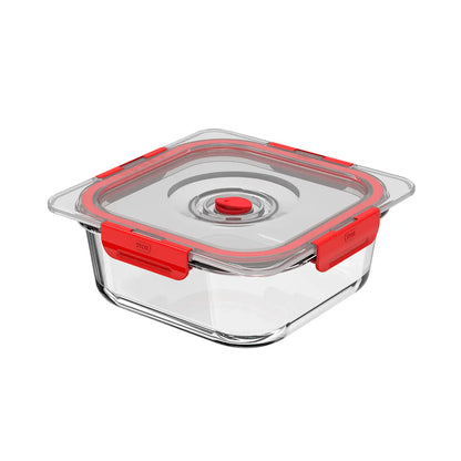 Glass food storage container with red lid on a white background