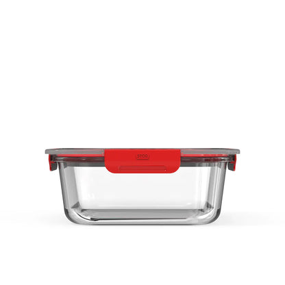 Clear rectangular food container with red lid on a white background