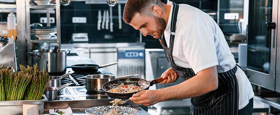 chefs cooking in kitchen