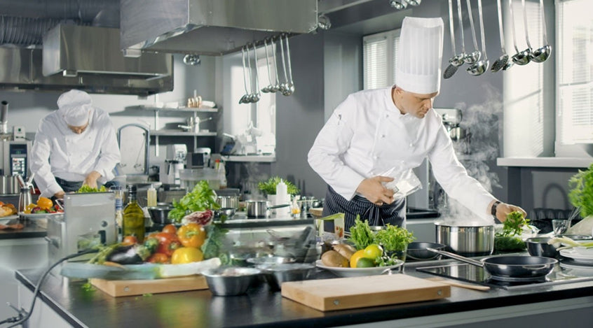 chefs cooking in kitchen